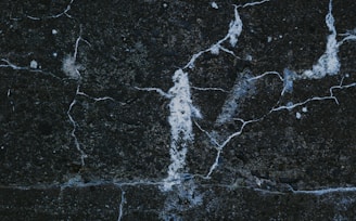 a close up of a black marble surface