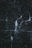 a close up of a black marble surface