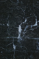 a close up of a black marble surface