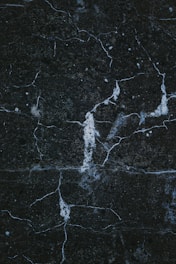 a close up of a black marble surface