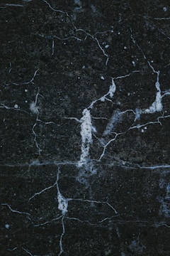 a close up of a black marble surface