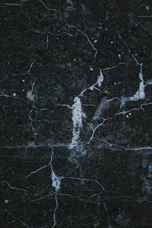 a close up of a black marble surface
