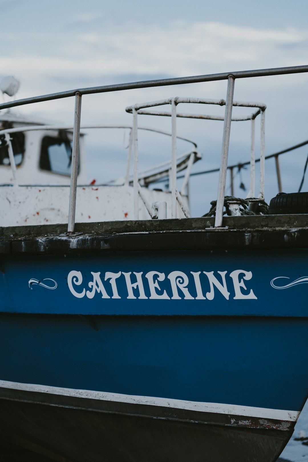 blue and white Catherine boat close-up photography