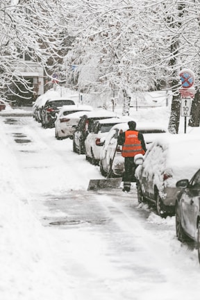 Sidewalk in South Surrey neatly shoveled with snow piled on the sides, showing community care.