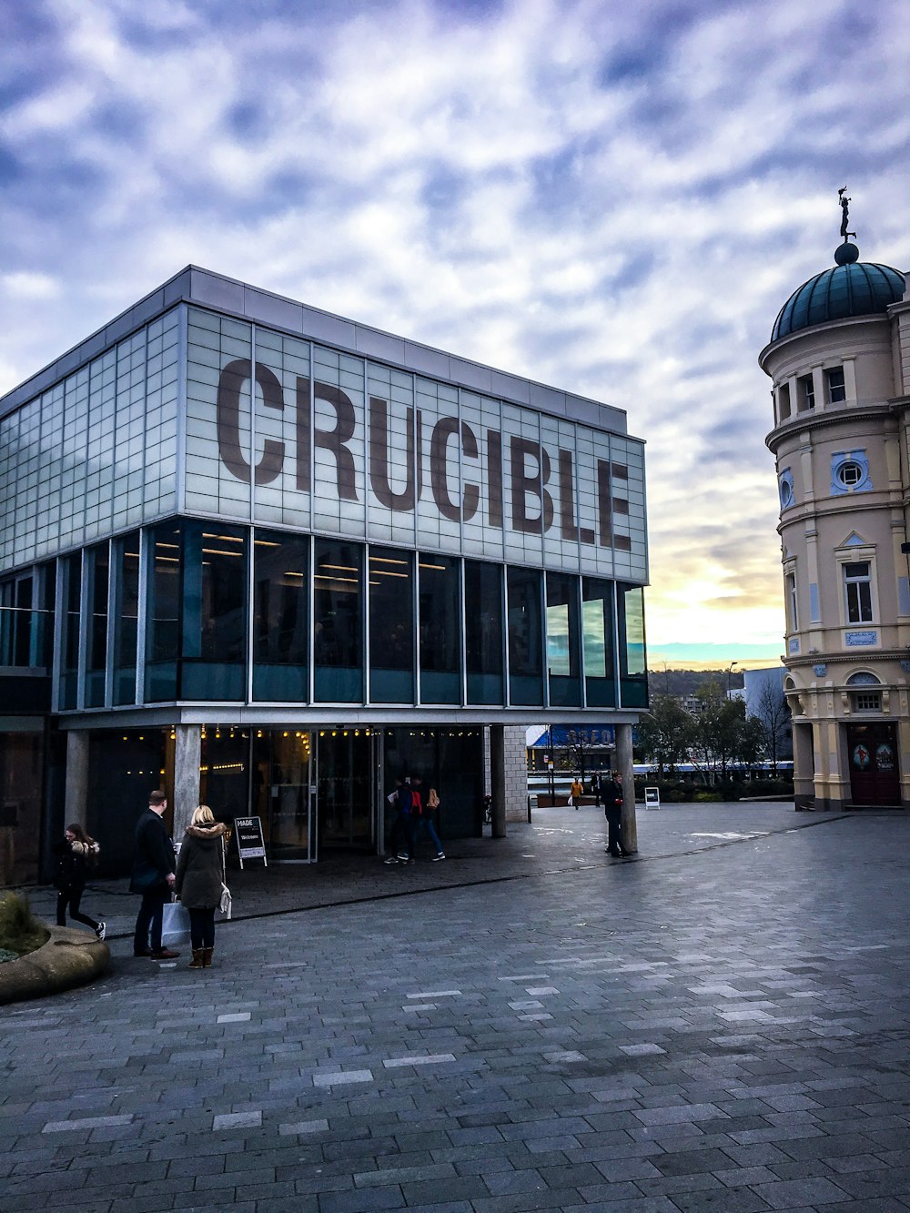 white and brown Crucible signage during daytime