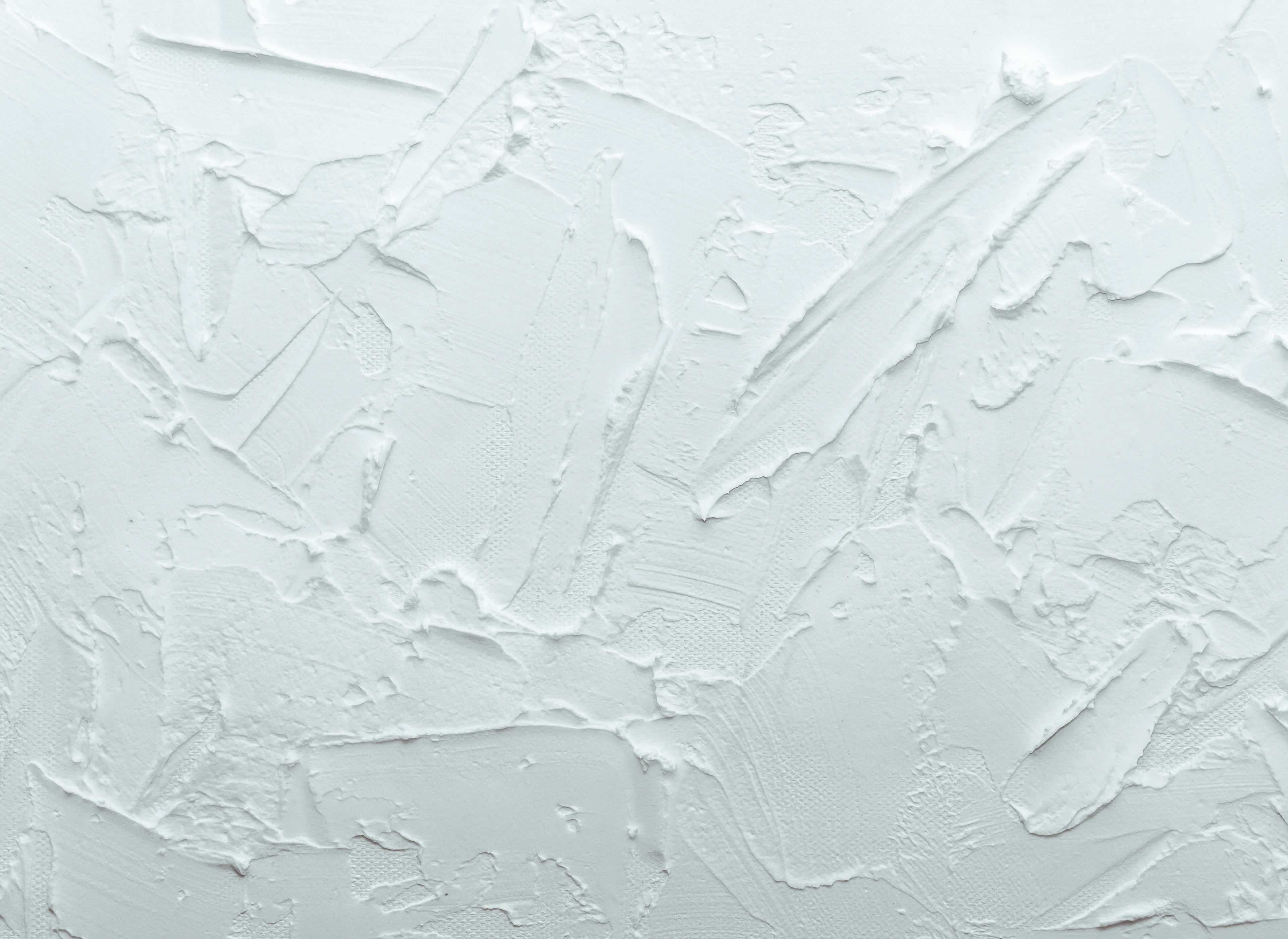 White wall with patched areas