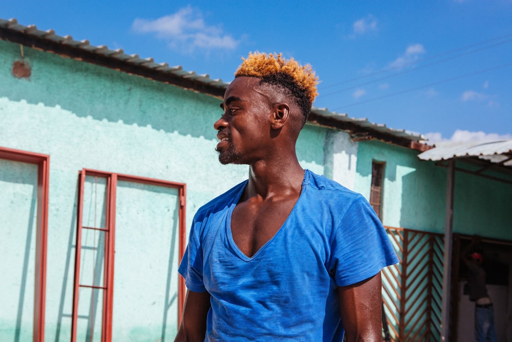 man wearing blue V-neck shirt