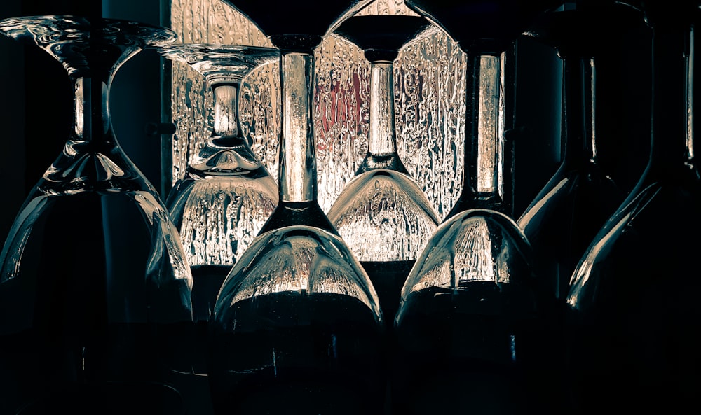 black glass bottles in black background