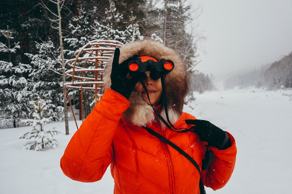woman holding binoculars