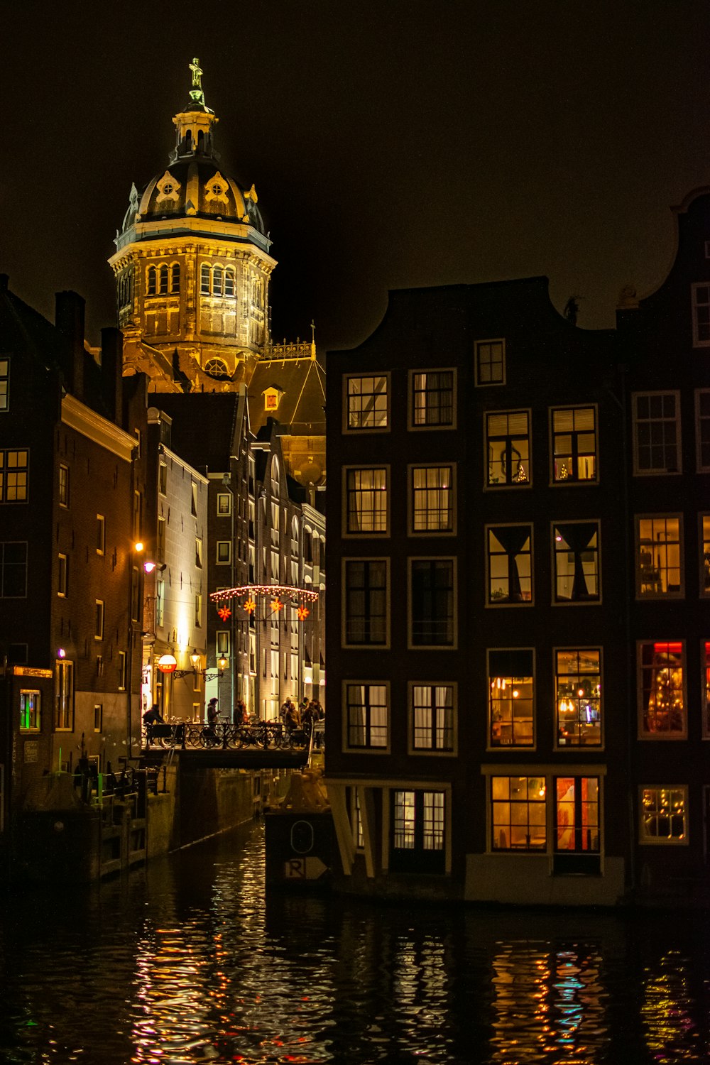 lighted canal buildings during night