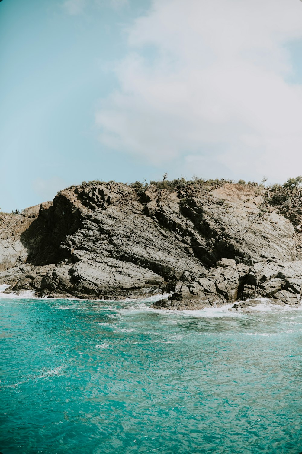 body of water and rock formation