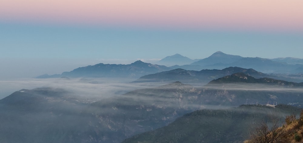 aerial photography of mountain and clouds