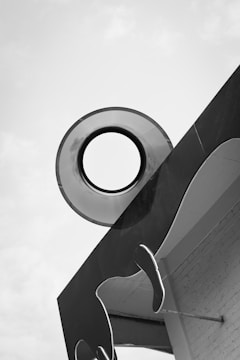 Abstract black and white geometric shapes forming a structure.