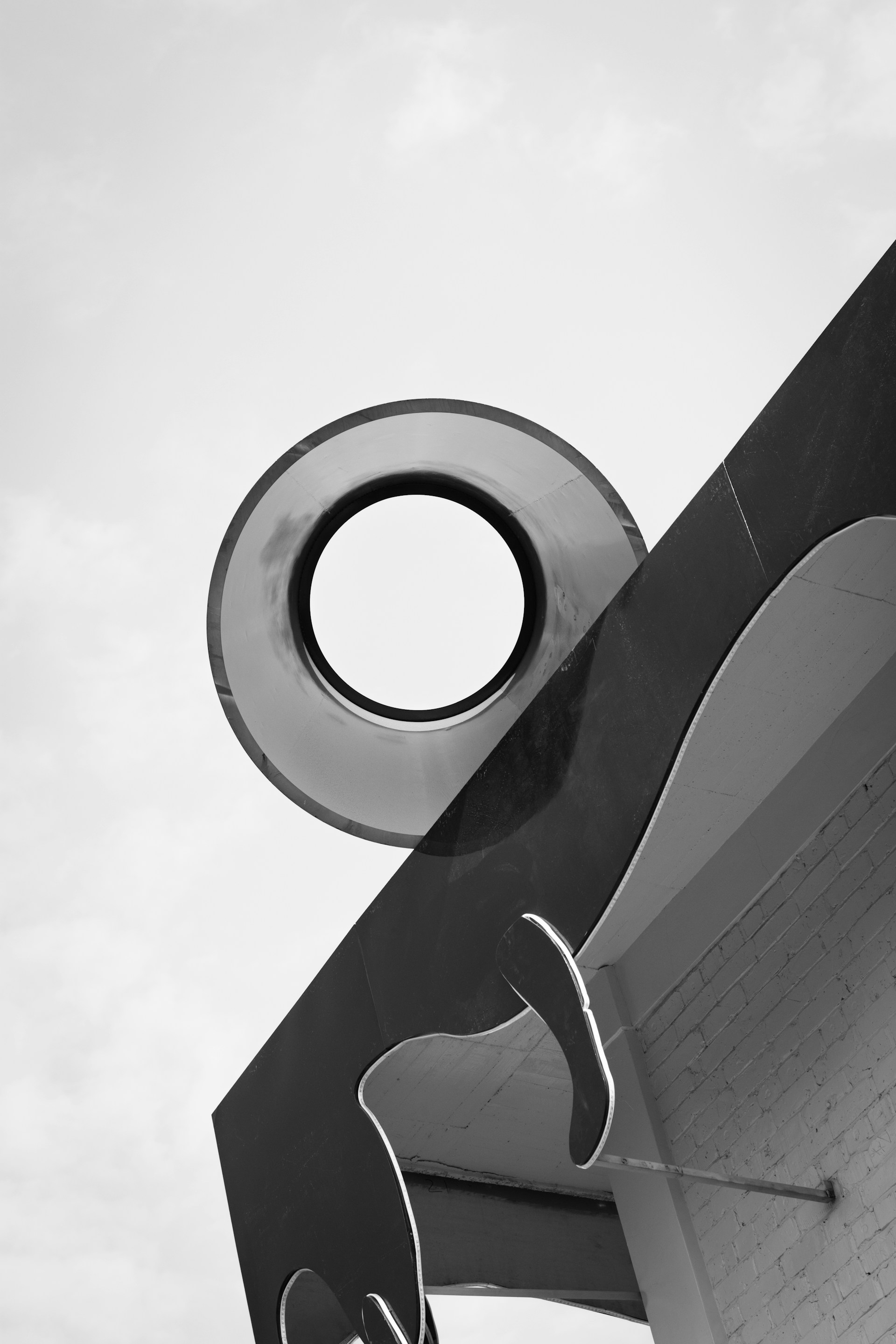 woman wearing yellow long-sleeved dress under white clouds and blue sky during daytime
