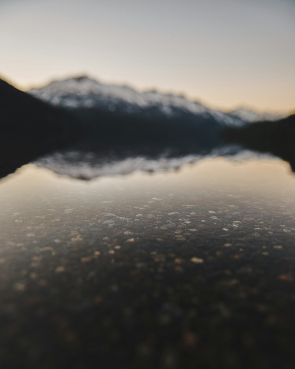 panoramic photography of mountain reflecting on water