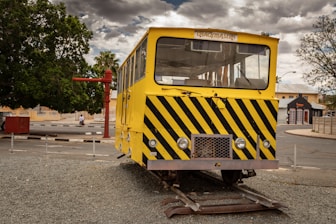 Engineers inspecting railway tracks with military vehicles nearby