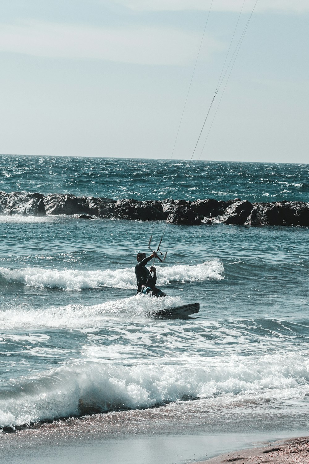 man playing surfing during daytime