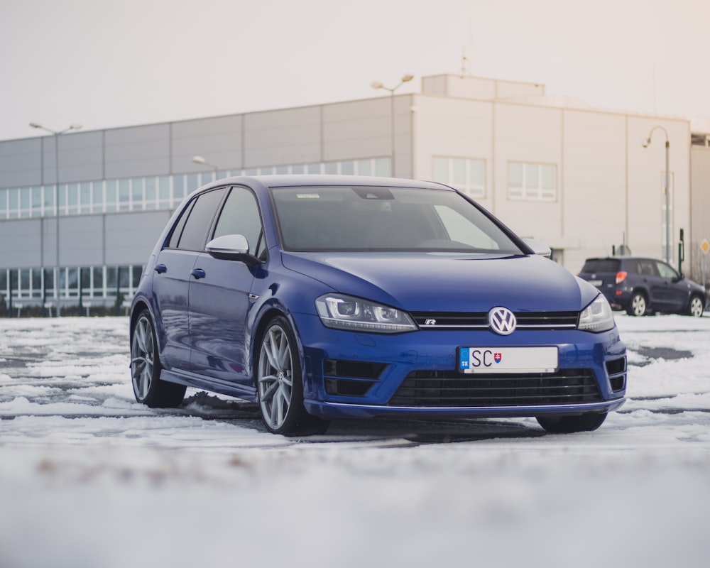 blue Volkswagen 5-door hatchback