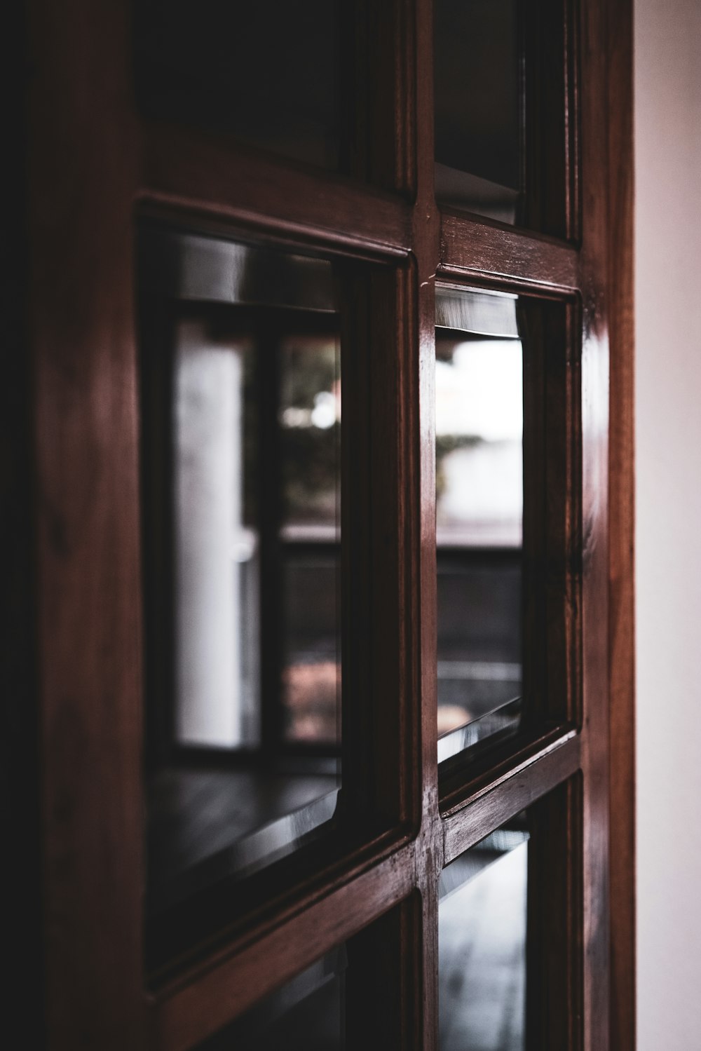 brown wooden framed glass door