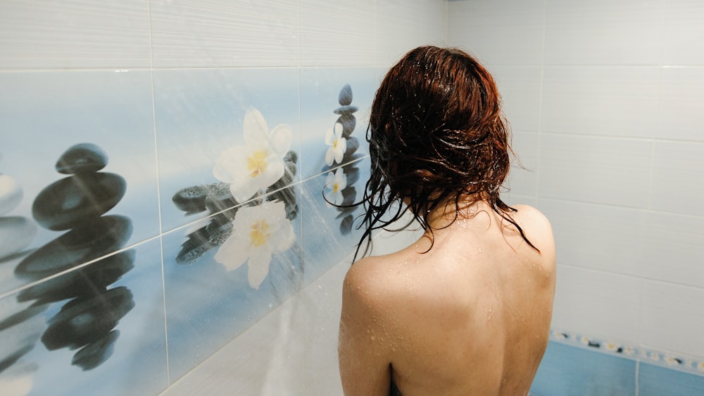 topless woman inside shower room