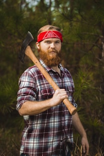 man carrying double-head axe