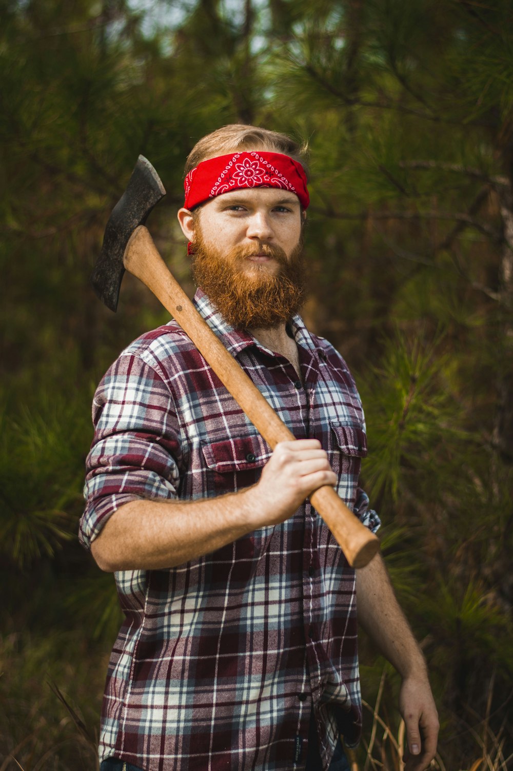 man carrying double-head axe