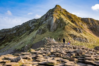 person standing behind mountain