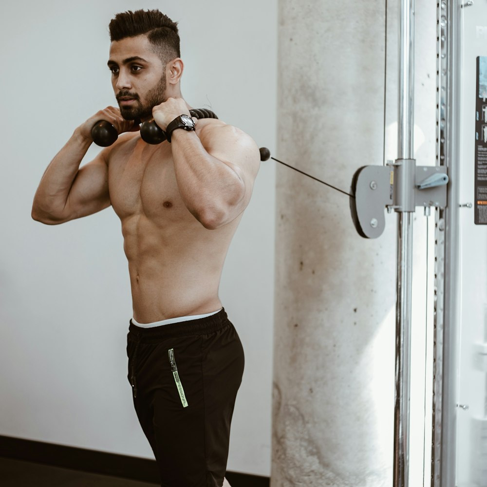 man wearing brown pants doing exercise