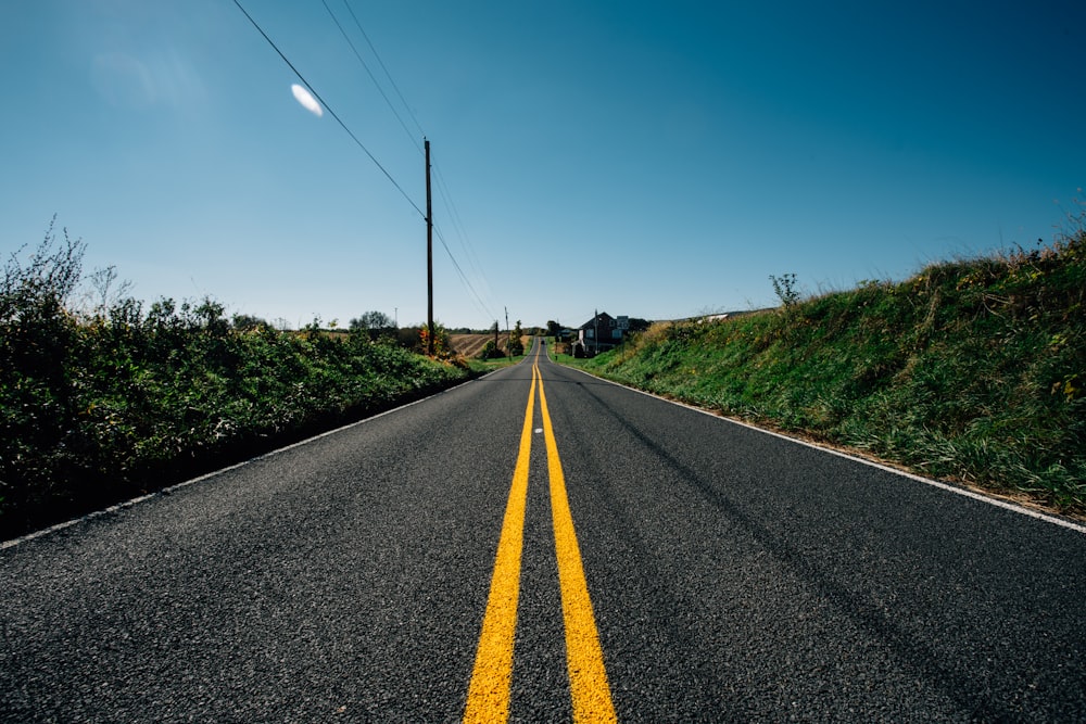 a road with a yellow line on the side of it