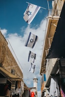 flags hanging on roof during daytime
