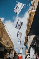 flags hanging on roof during daytime