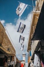 flags hanging on roof during daytime