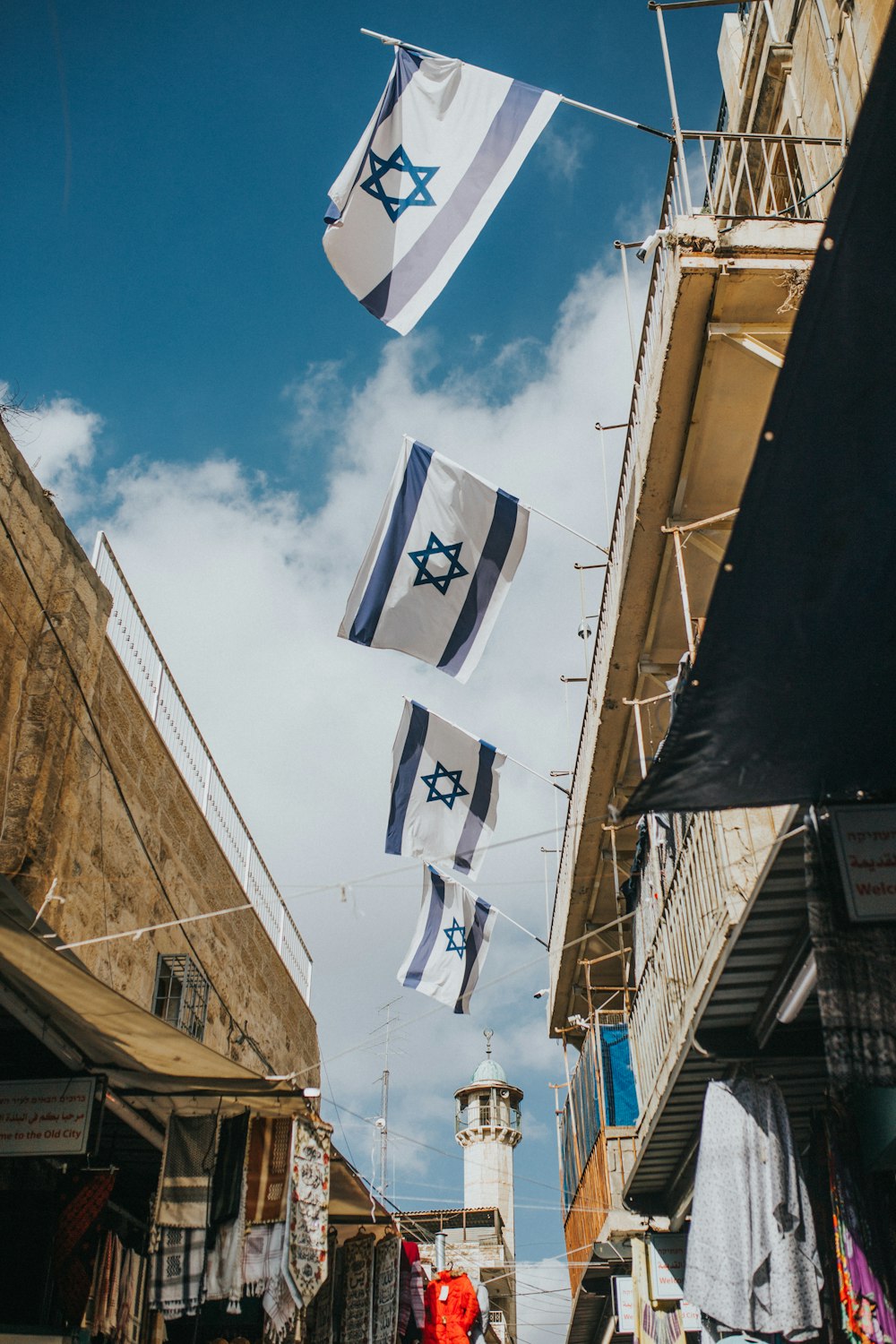 flags hanging on roof during daytime