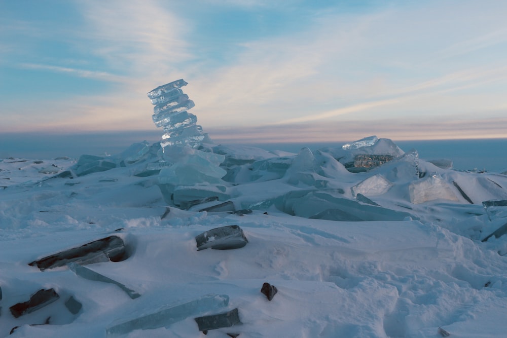 ice formation on snow field under white sky