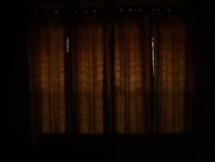 Custom-dyed blackout curtains in deep blue, perfectly fitted in a boutique hotel room.