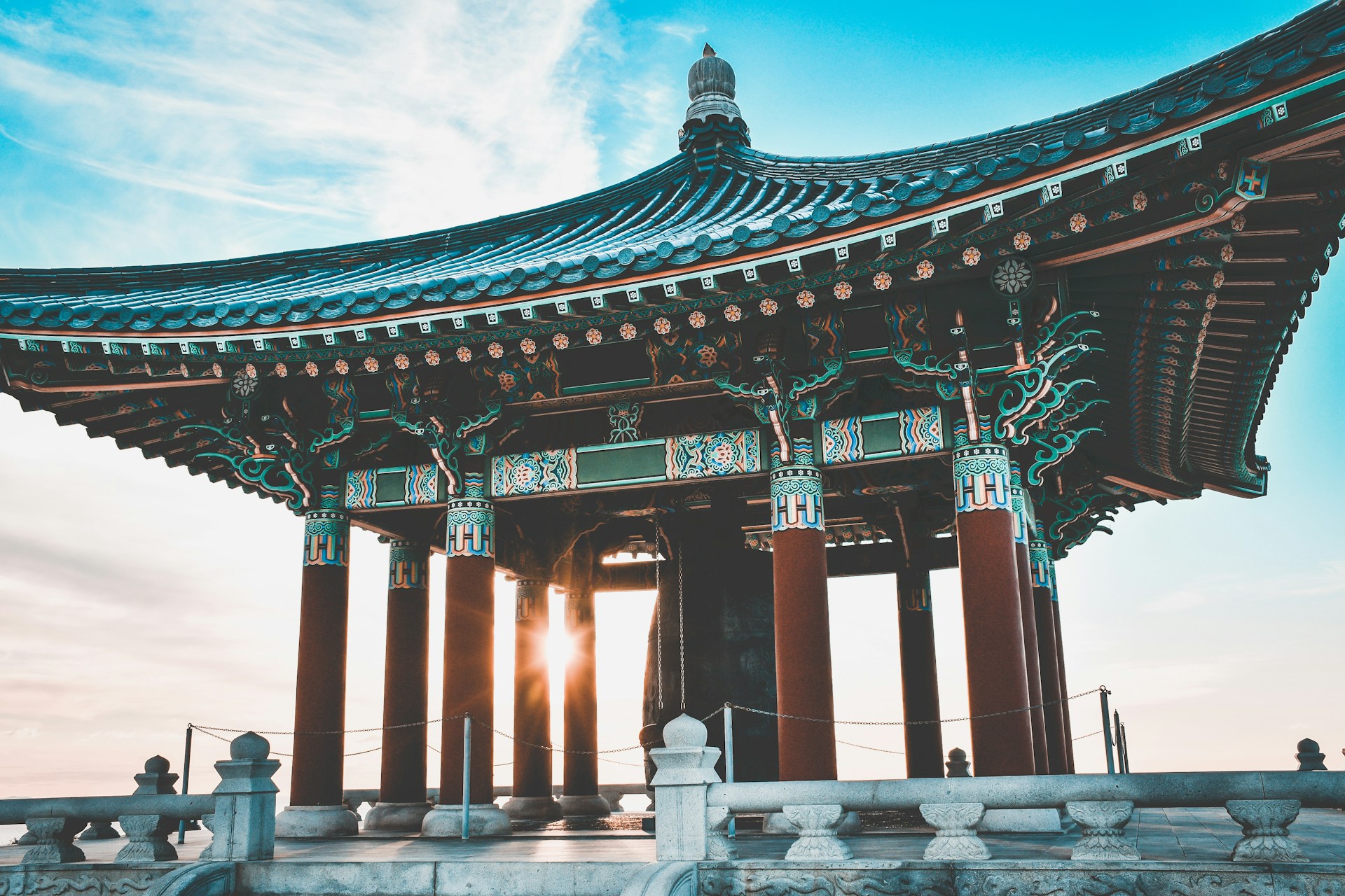 woman wearing yellow long-sleeved dress under white clouds and blue sky during daytime