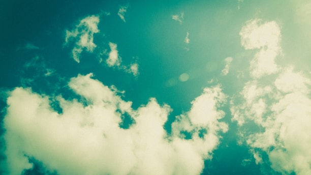 A vibrant anime-style guild gathering under a pastel blue sky with soft clouds.