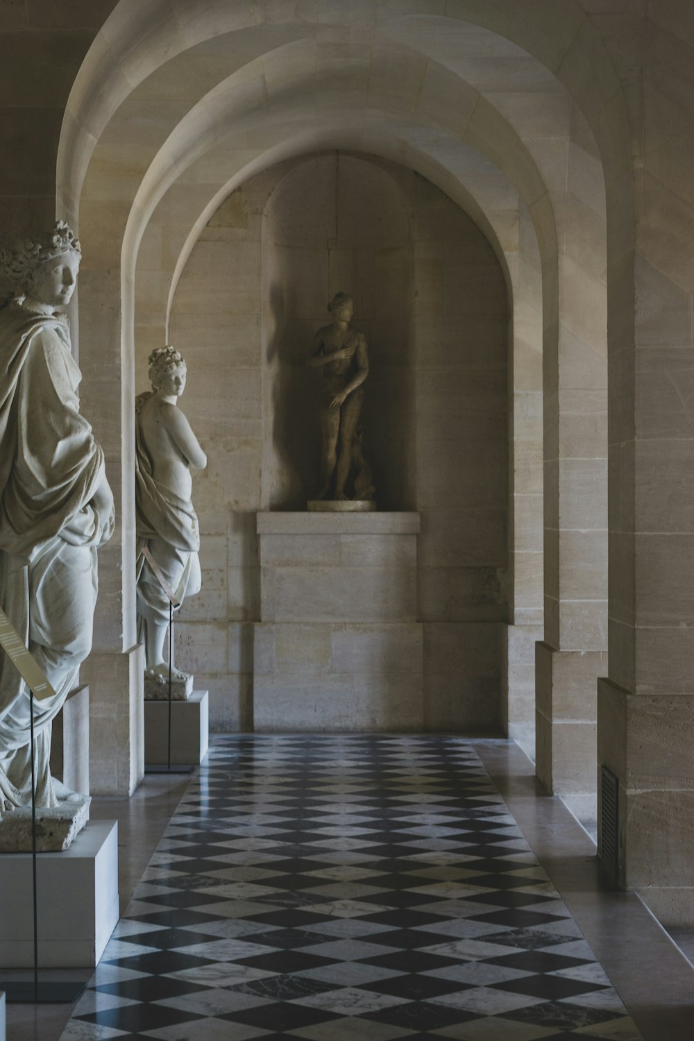 topless woman statue inside building