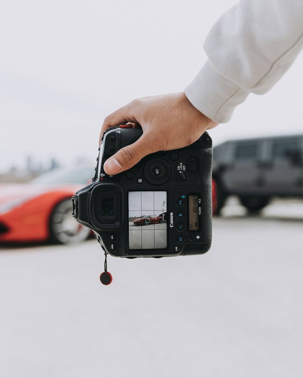 person holding black DSLR camera