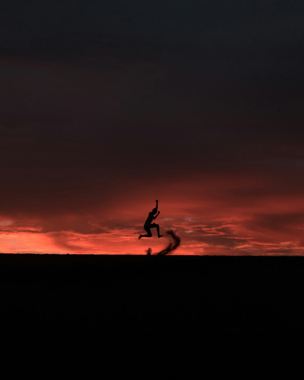 silhouette of person jumping