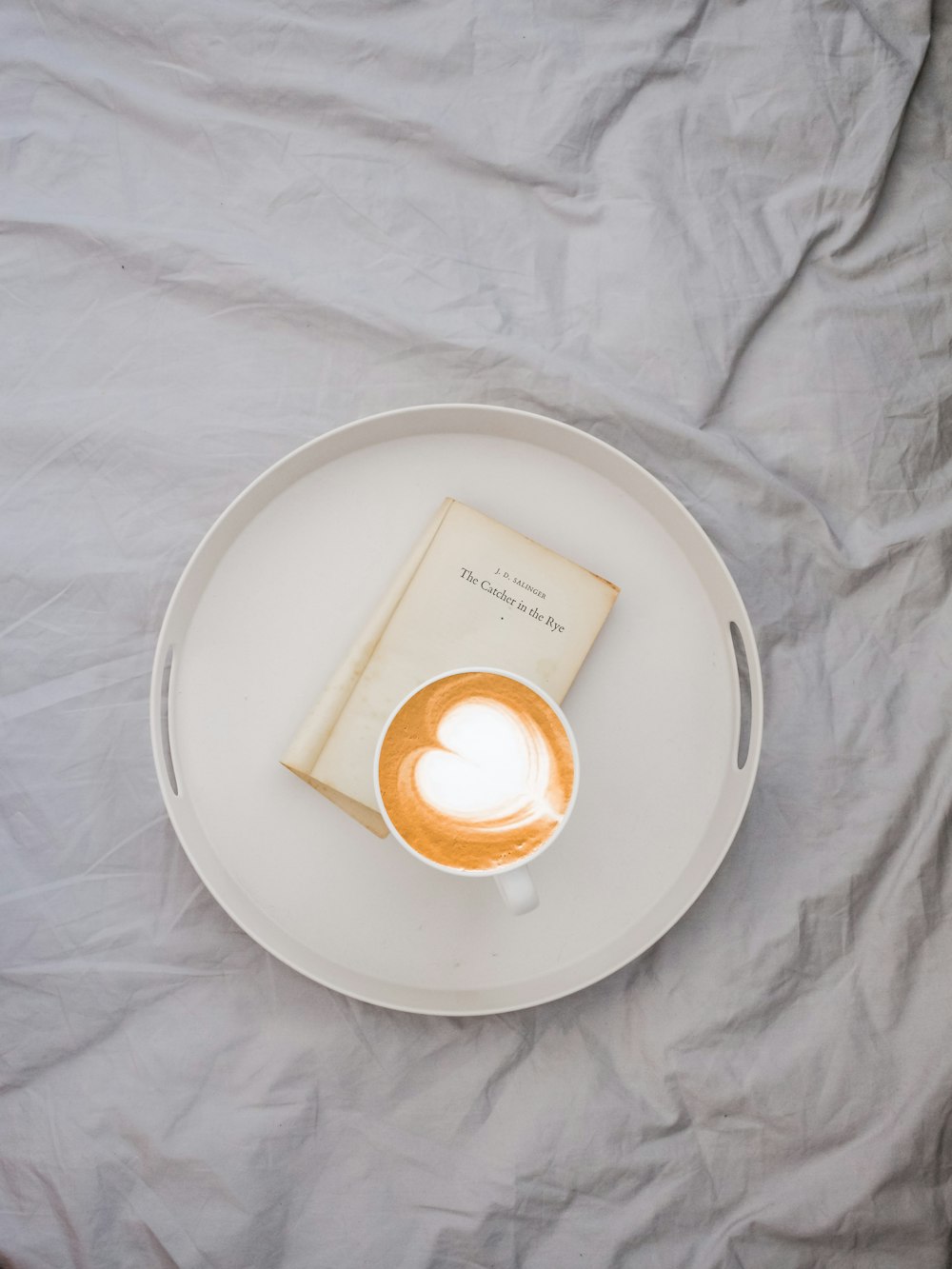 latte art on round white tray