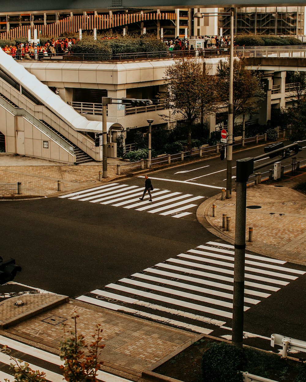 man walks across pedestrian lane