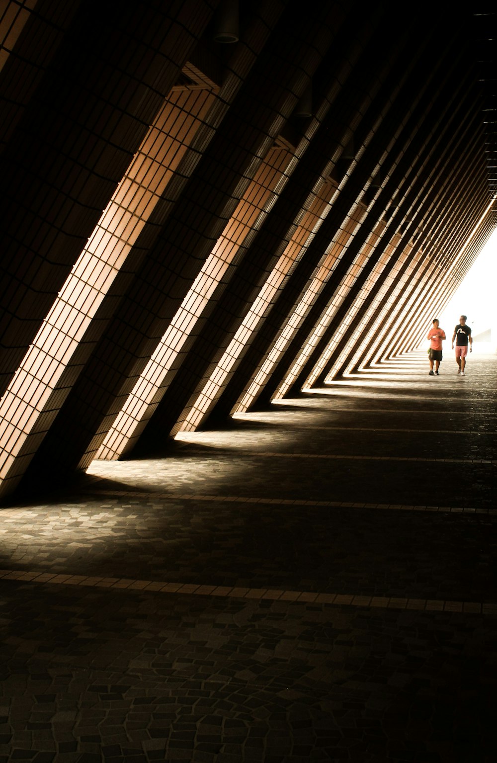 two person standing under arch