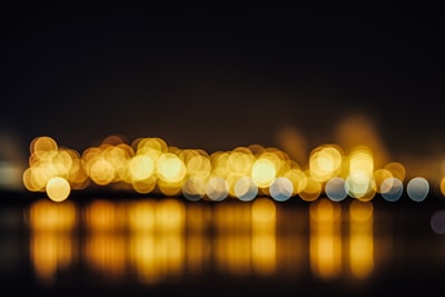 bokeh photography of yellow light brilliant teams background