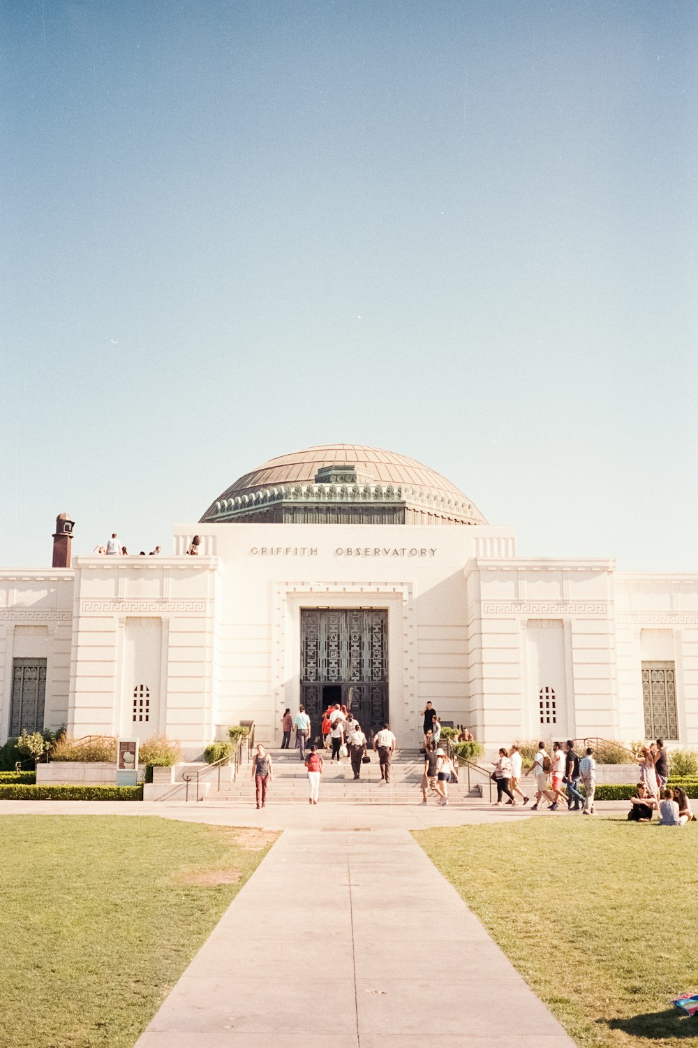 people near dome building