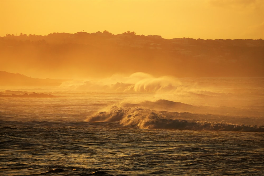 rippling body of water during sunset