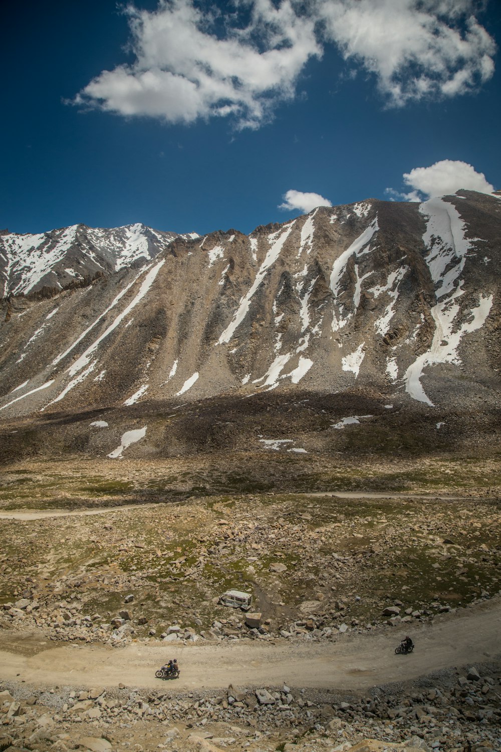 brown cliff under white and blue sky