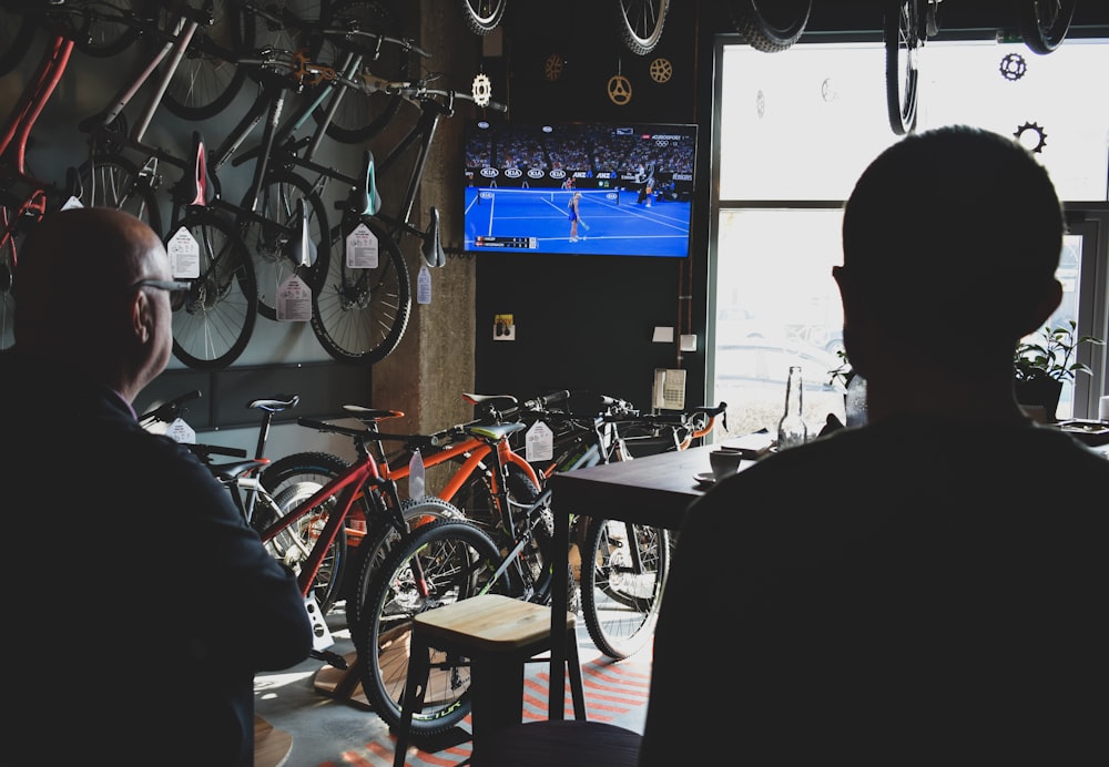 two men watching TV