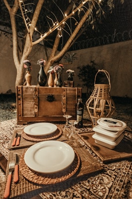 round white ceramic plates on wicker mat