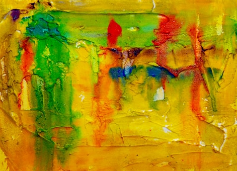 A vibrant yellow abstract painting with bold strokes, symbolizing creativity and energy.